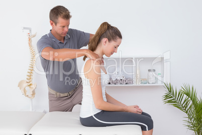 Doctor doing neck adjustment