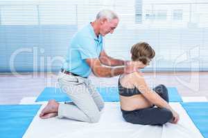 Therapist massaging pregnant woman