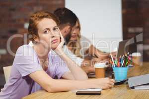 Portrait of businesswoman with hand on chin