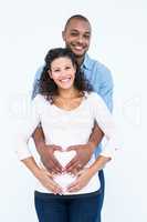 Portrait of couple with hands on belly