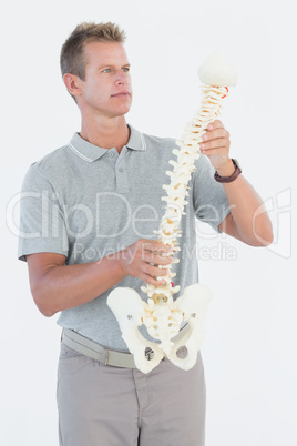 Doctor with anatomical spine