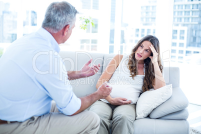 Therapist advising preganant woman