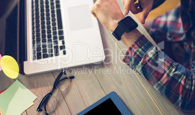 High angle view of businessman checking time