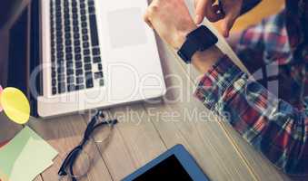 High angle view of businessman checking time