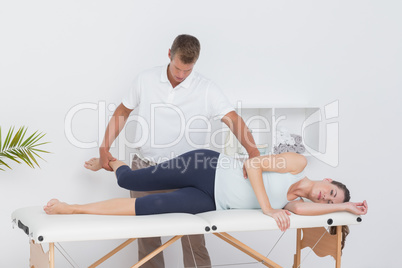 Doctor examining his patient leg