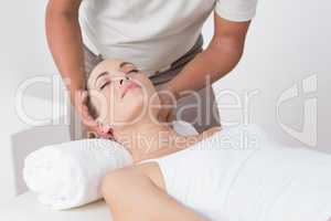 Woman receiving neck massage