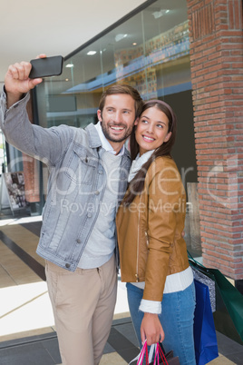 Young happy couple taking a selfie