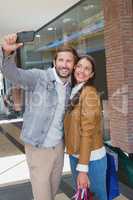 Young happy couple taking a selfie