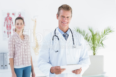 Doctor and patient looking at camera