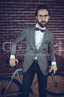 Portrait of smart man with bicycle