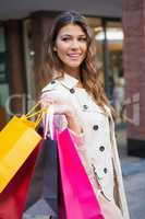 Smiling woman with shopping bags