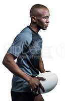 Confident sportsman with rugby ball