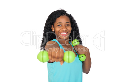 Woman exercising using dumbbells Woman exercising using dumbbells