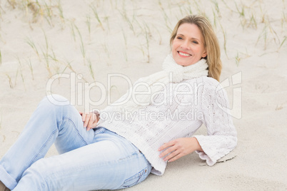 Woman lying down on the sand