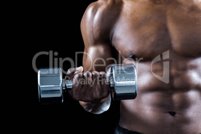 Cropped image of muscular athlete exercising with dumbbell