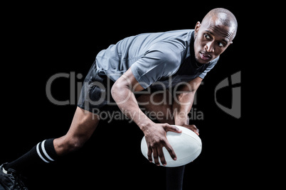 Determined sportsman looking away while playing rugby