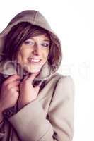 Attractive woman wearing a warm coat with hood raised