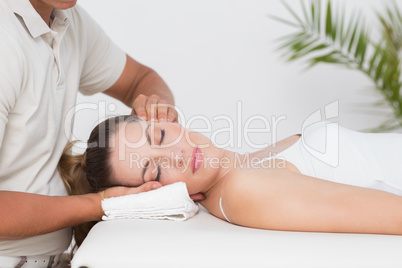 Woman receiving neck massage