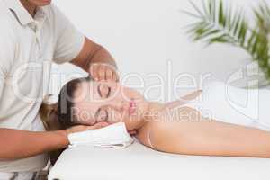 Woman receiving neck massage