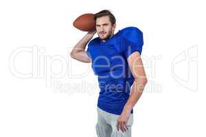 American football player throwing the ball