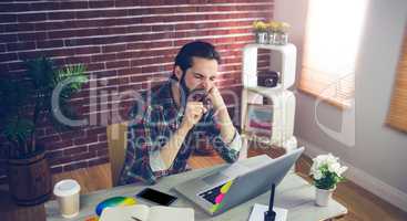 High angle view of businessman yawning at office