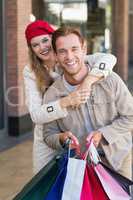 A happy couple with shopping bags