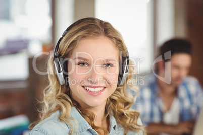 Confident smiling businesswoman in office