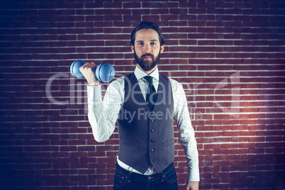 Portrait of man holding dumbbell