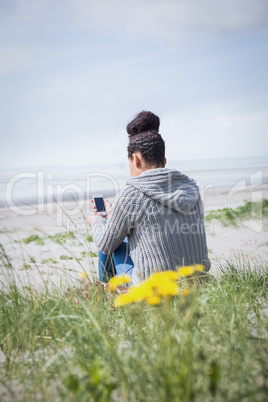 Beautiful woman using her mobile phone