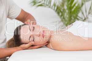 Woman receiving neck massage