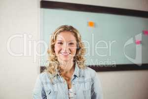 Portrait of happy businesswoman creative office