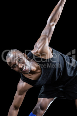 Portrait of happy sportsman exercising