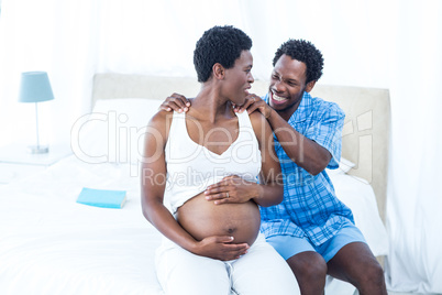 Man massaging pregnant wife Man massaging pregnant wife