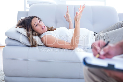 Preganant woman talking with therapist