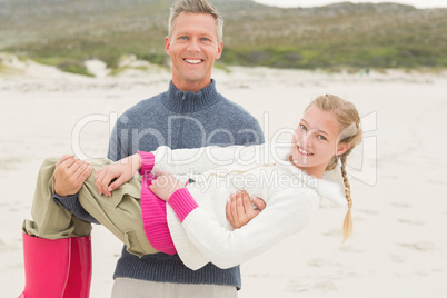 Father holding his daughter off the ground