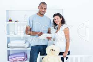 Portrait of couple with clipboard