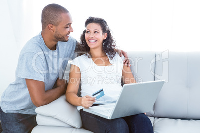 Happy couple shopping online