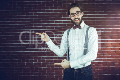 Portrait of confident hipster gesturing