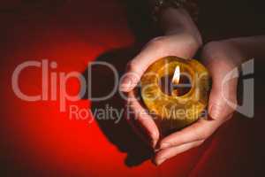 Fortune teller holding a candle