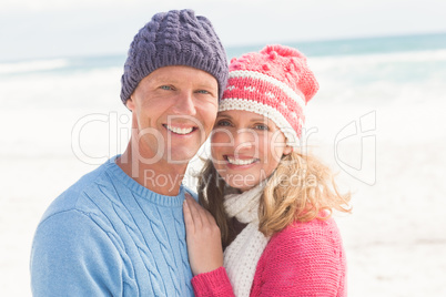 Smiling happy couple hugging each other