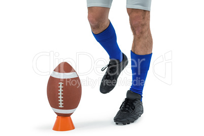 American football player being about to kick ball
