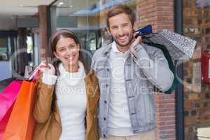 Young couple smiling while looking at the camera