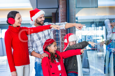 Happy family pointing at something