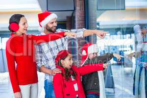 Happy family pointing at something