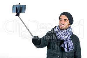 Bearded man using a selfie stick