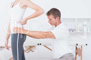 Doctor examining his patient back