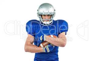 Portrait of confident sportsman holding ball