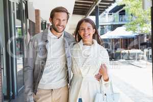 Young couple smiling while walking