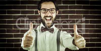Portrait of happy hipster with thumbs up gesture