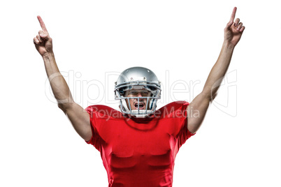 American football player with arms raised standing